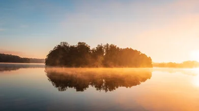 Photo art by Nils Steiner: calm sunrise over a misty lake