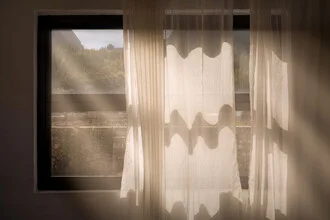 Photo art by AJ Schokora: gentle light patterns through a window in late summer