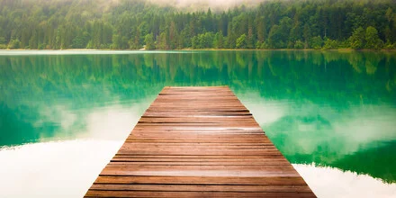 Photo art by Martin Wasilewski: tranquil lake with a pier and gentle fog