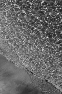 Photo art: black and white capture of sand and water at the beach