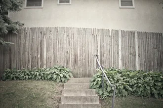Photo art by Erin Kao: soft colors and clear lines of a garden fence