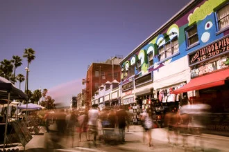 Charming photo art featuring people, palms, and shops at Venice Beach.