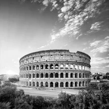 Photo art of the Colosseum in Rome at sunset, warm light and gentle shadows.