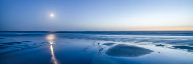 Wadden Sea under full moon: tranquil coastal scene with water and sky