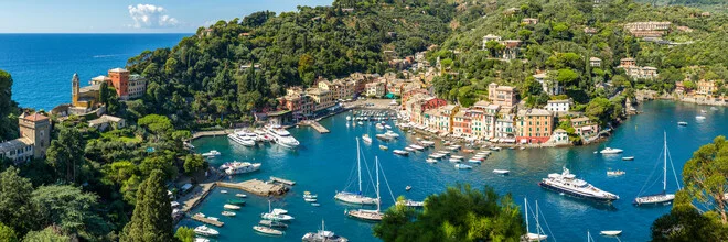 Panoramic view of Portofino in summer with colorful houses by the harbor.