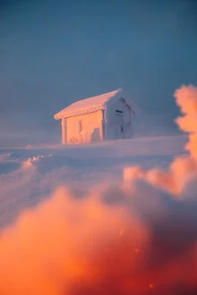 Photo art by André Alexander: winter landscape with a snow-covered cabin in Finland