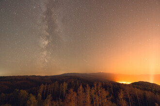 Oliver Henze, Starry sky and Milky Way over landscape of Wernigerode (Germany, Europe)