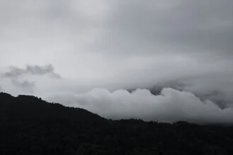 Black and white photo art by Studio Na.hili: mountains beneath a cloudy sky