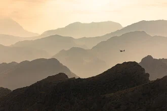 Photo art by Christian Köster: airplane over the mountains of Mallorca at sunset
