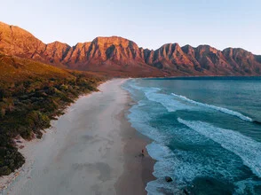 Photo art by André Alexander: gentle sunset over mountains and ocean in South Africa