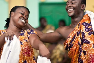 Vibrant depiction of a dance group in Kumasi, Ghana, filled with joy and tradition.