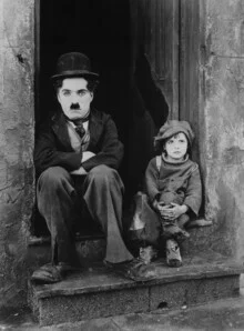 Photo art by Vintage Collection: Charlie Chaplin and Jackie Coogan in a nostalgic scene