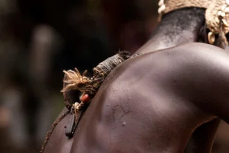 Jara dancer in Tarikpaa village, Ghana, cheerful traditional dance scene.