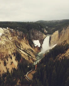Photo art by Kevin Russ: waterfall surrounded by pine trees in Yellowstone National Park