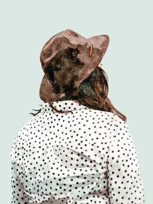 Lovely portrait of a woman in winter fashion with a hat and polka dots