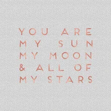 Lovely photo art featuring the sun, moon, and stars in soft colors.
