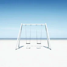 Photo art by Manuela Deigert: swing at the beach under a calm sky and gentle waves