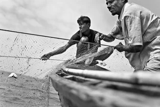 Photo art by Jakob Berr: Fisherman in the Bay of Bengal with boat and net