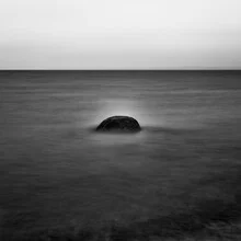 Photo art by Robert Kuavi: minimalistic image of a stone by the sea