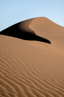 Photo art: simple sand dune with soft shadows and a minimal pattern