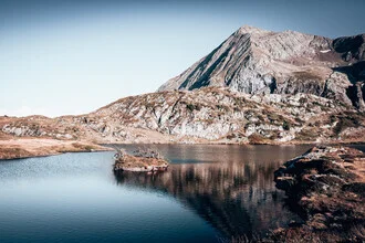 Photo art by Eva Stadler: calm mountain lake surrounded by majestic mountains