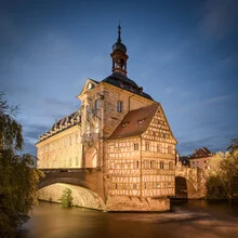 Photo art: View of the old town hall in Bamberg at night with gentle lighting.