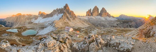 Panoramic view of Tre Cime di Lavaredo at sunset in the Dolomites.