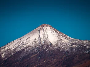 Photo art by Martin Wasilewski: summit of Teide surrounded by clouds and blue sky.