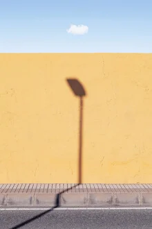 Photo art by Rupert Höller: a snake on a street under a clear sky.