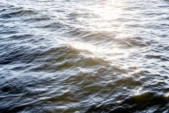 Photo art by Mareike Böhmer: gentle waves in sunlight at the ocean