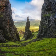 Photo art by Jean Claude Castor: rocky formation on the Isle of Skye under dramatic clouds.