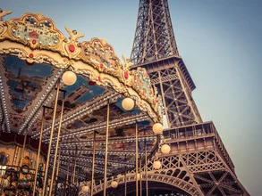 Photo art by Johann Oswald: carousel with Eiffel Tower in the background, blue sky