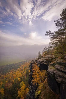 Autumn view from Lilienstein featuring mountains and fog over the forest