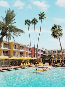 Photo of a modern hotel in Palm Springs featuring palm trees and a pool