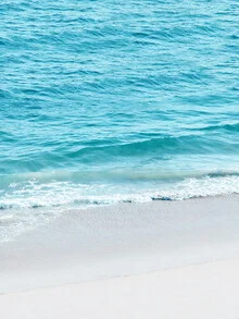 Photo art by Gal Pittel: gentle waves at Malibu beach under a clear sky.