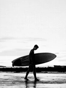 Black and white photo art: boy surfing in Los Angeles under cloudy sky