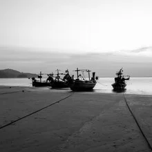 Photo art by Christian Janik: fishing boats on calm waters in Thailand.