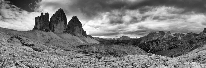 Black-and-white photo of the Three Peaks in the Dolomites, peaceful mountain landscape.