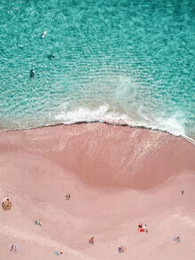 Photo art: Aerial view of a pink beach with a surfer and sun umbrella