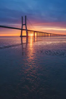 Photo art by Jean Claude Castor: sunrise over the Vasco da Gama Bridge in Lisbon
