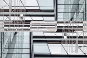 Abstract facade featuring lines and reflections in calm colors