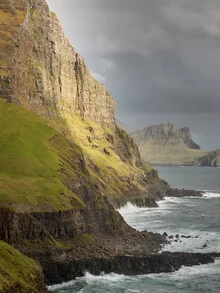 Photo art by Norbert Gräf: coastal landscape with cliffs and clouds at dusk