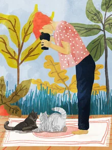 Wall art of a relaxed cat enjoying a picnic with a woman outdoors.
