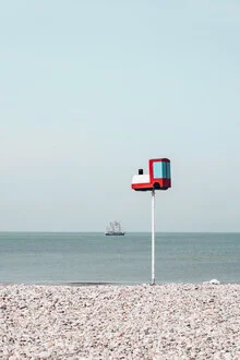 Photo art by Eva Stadler: locomotive on pebble beach in Le Havre, relaxed beach atmosphere
