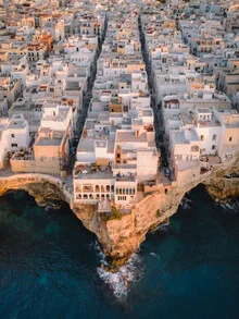 Photo art by Luca Talarico: view of white houses in Polignano a Mare by the sea.