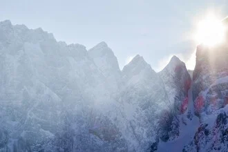 Photo art by Lotte Wildiers: gentle sunset over snowy mountains in Slovenia