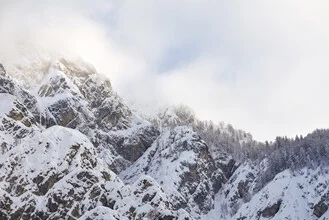 Photo art by Lotte Wildiers: sunlight breaking through the winter mountain landscape