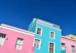 Wall art by Lotte Wildiers: colorful houses in Bo-Kaap, South Africa, under a clear sky