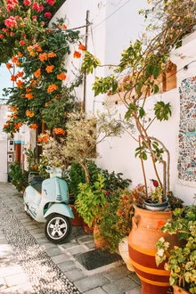 Photo art by Lotte Wildiers: a vespa in a blooming Greek alley