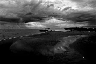 Photo art by Sankar Sarkar: calm view of Chilka Lake at sunset